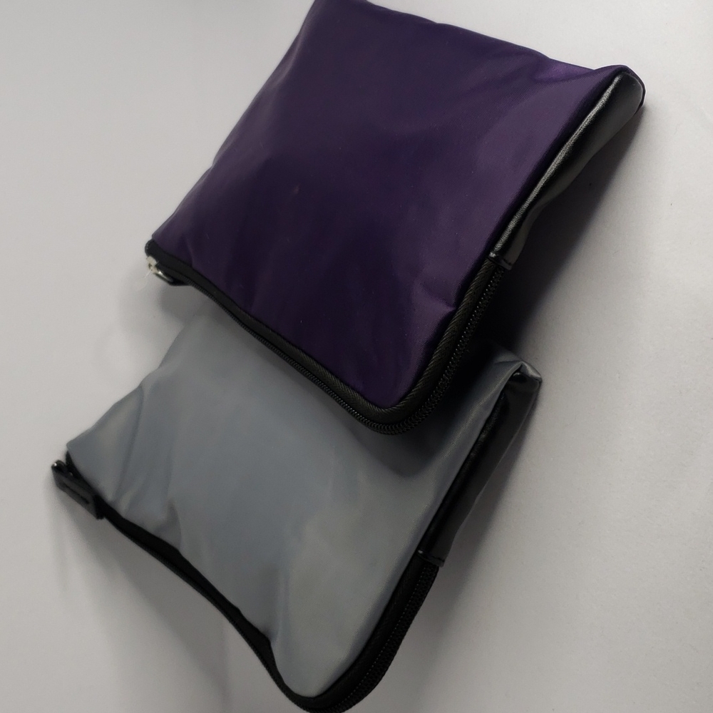 1 Tumi pouch filled with travel goodies